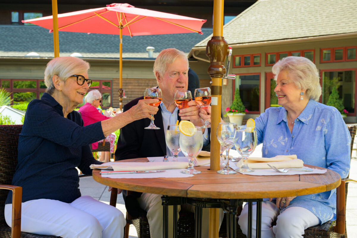 Exterior_RoofDeck_Linda-Phillips_Larry-Phillips_Pat-Margolies_Toasting_Umbrella_Table_Edgehill-1156.jpg