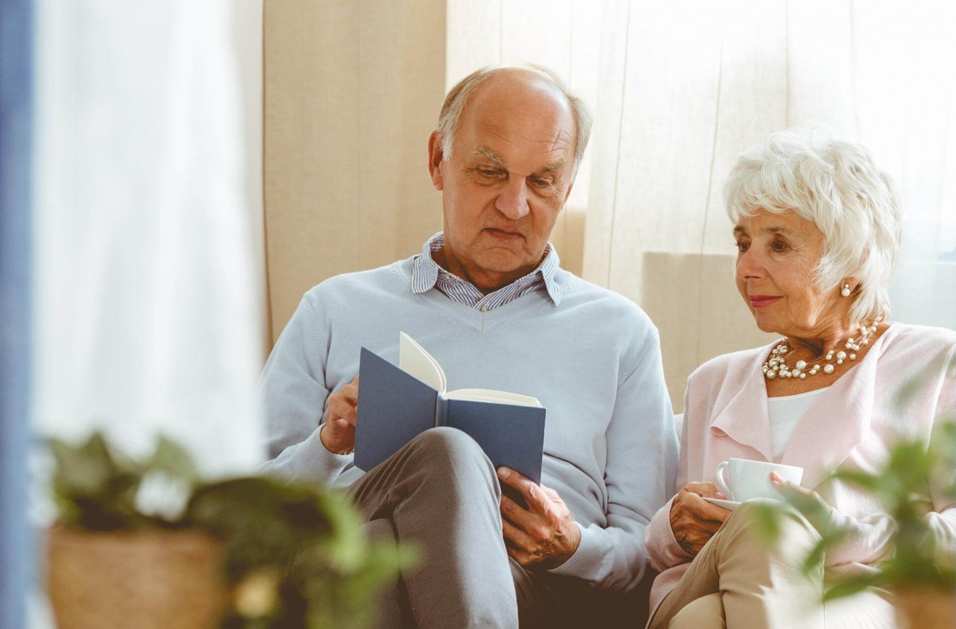 Senior couple reading book