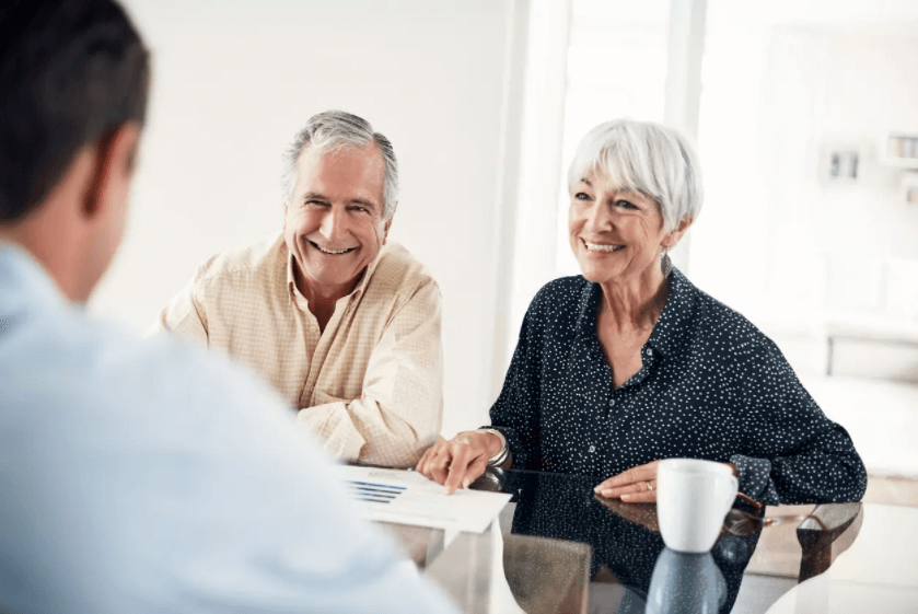 Senior man and woman meeting with financial advisor