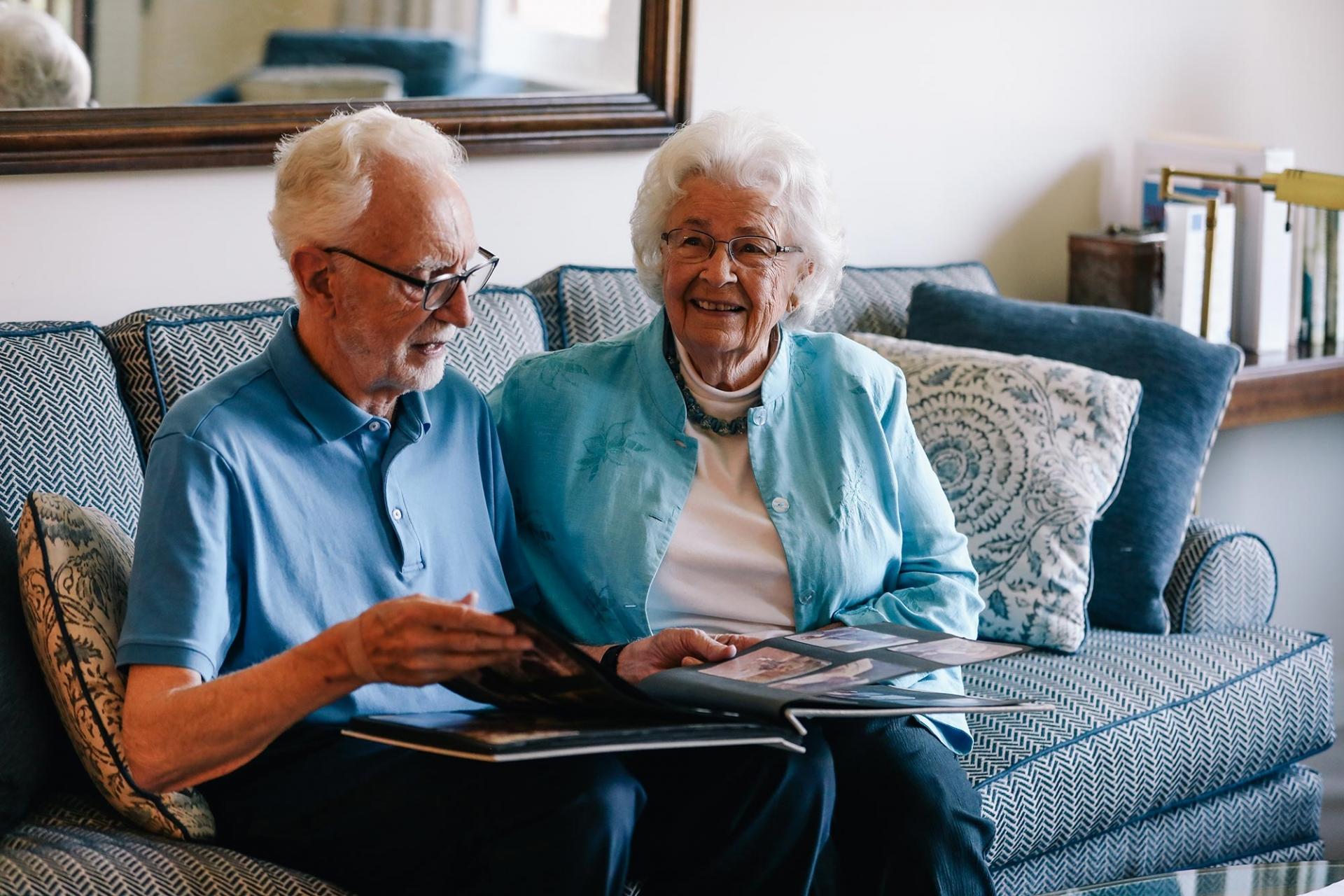 Senior couple looking at scrapbook