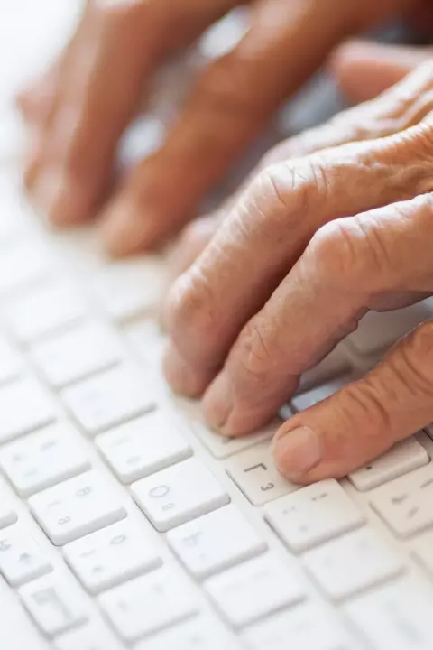 Man typing on keyboard