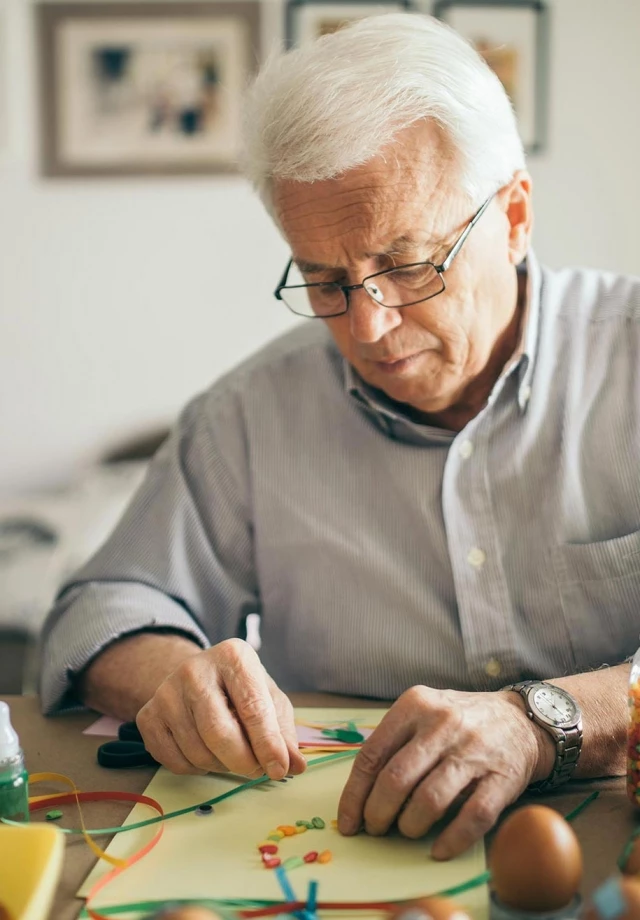 Senior man doing arts and crafts