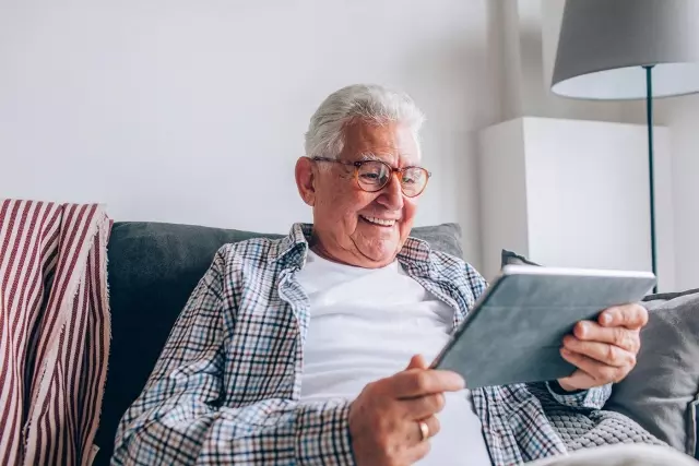 Senior man looking at iPad