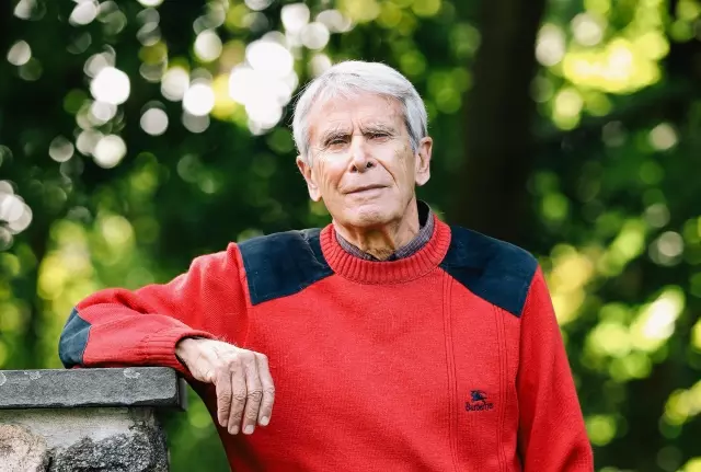 Senior man posing for photo outdoors