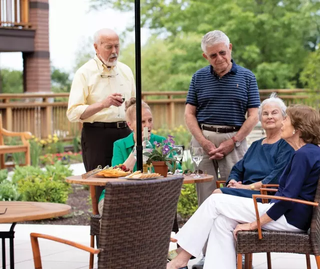 Seniors having meal outdoors