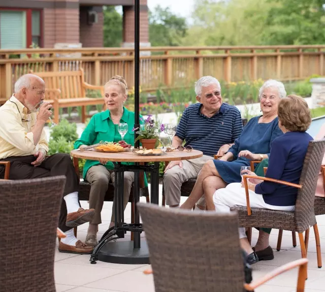 Seniors having meal outdoors