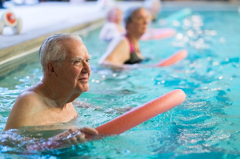 Seniors in water aerobics class