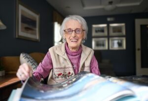 Senior woman looking at scrapbook