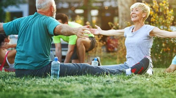 Seniors doing yoga outdoors