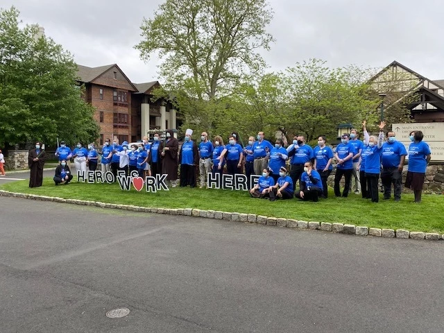 Edgehill staff with Heroes Work Here shirts