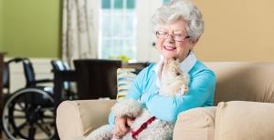 Senior woman holding dog