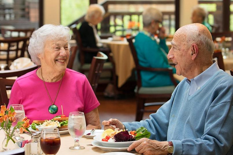 Senior man and woman having meal