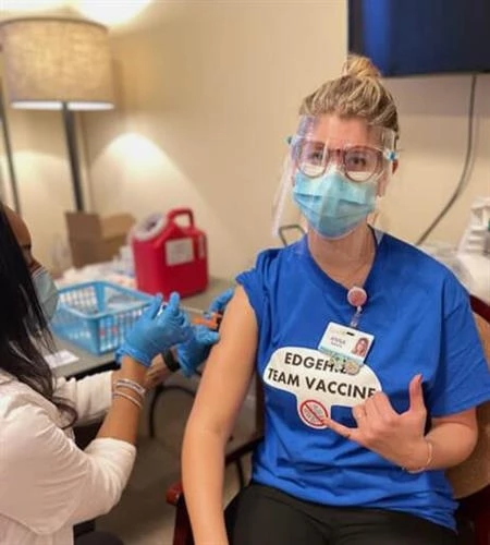 Caregiver receiving Covid vaccine