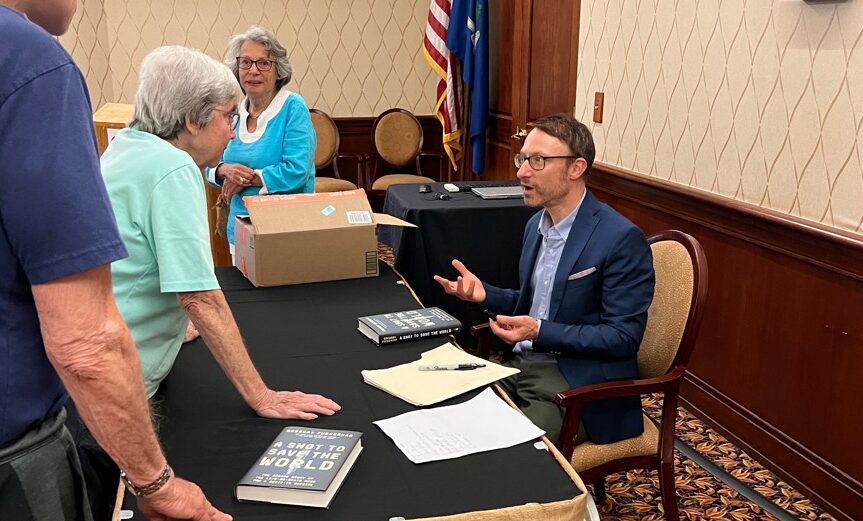 Author and guest lecturer speaks with residents
