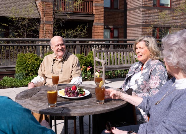 Residents gathering on exterior rooftop