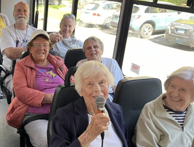 With microphone in hand, Bobbie leads a tour through the Greenwich she’s known and loved for decades.