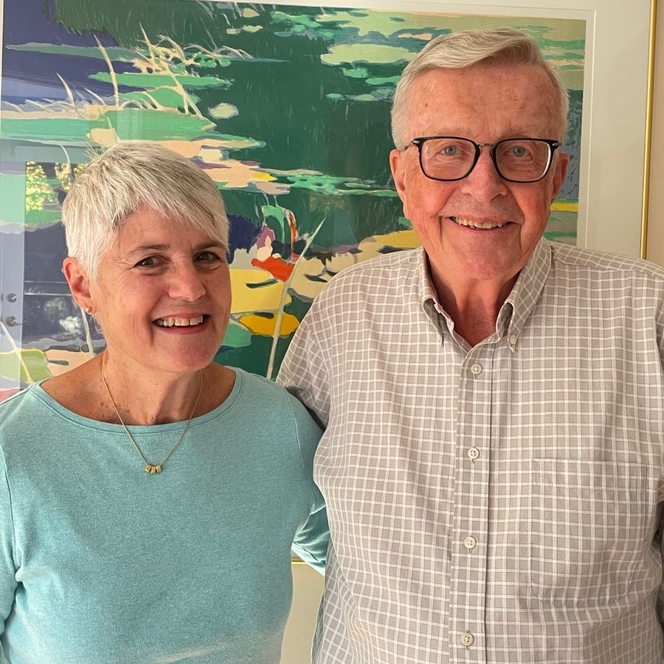 Resident Laura Godown and her husband Dean standing side by side smiling