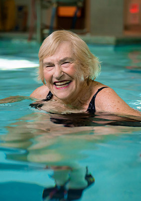 Resident Evie floating in the Edgehill pool